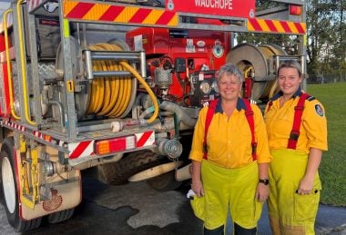 Two volunteers from the Mid North Coast stand in front of an emergency vehicle, in the lead-up to the 2023 Regional Volunteer of the Year Awards, one of the biggest volunteer recognition programs in the state.